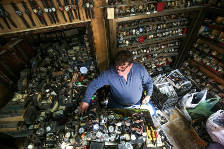 Thousands of watches fill Youssef Abdelkarim's tiny shop, where three generations have repaired Iraq's oldest timepieces