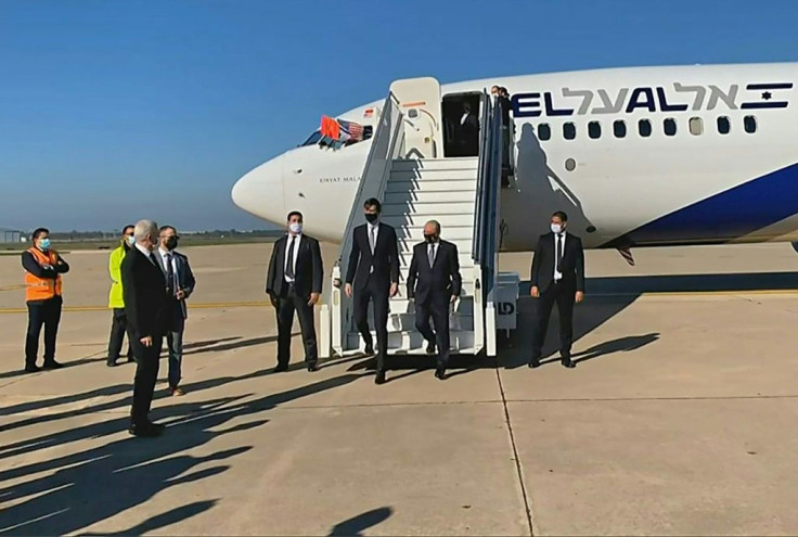 US President Donald Trump's son-in-law and advisor Jared Kushner (L) and Israeli National Security Advisor Meir Ben Shabbat leave the plane in Rabat