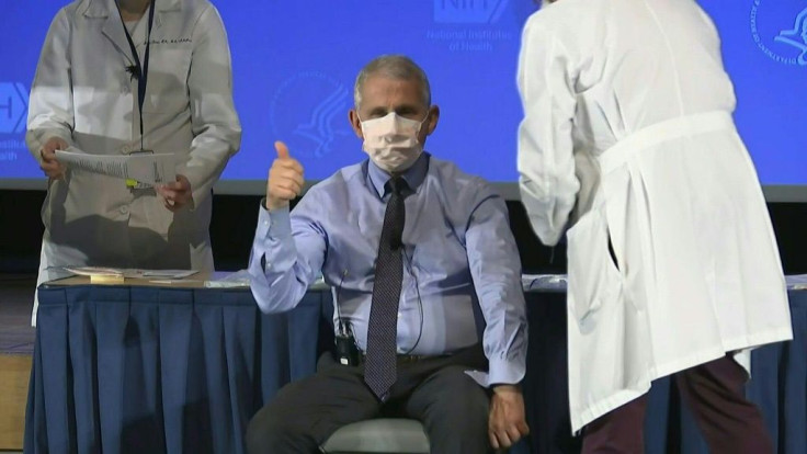 Anthony Fauci, the United States' top infectious disease scientist, receives a dose of Moderna's Covid-19 vaccine along with US Health secretary Alex Azar and other senior officials at the National Institutes of Health (NIH).