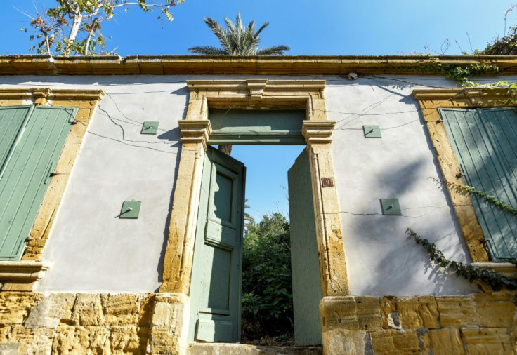 A Turkish Cypriot owned abandoned building, inner walls no longer in existence and overgrown with vegetation, in Nicosia, the world's last divided capital