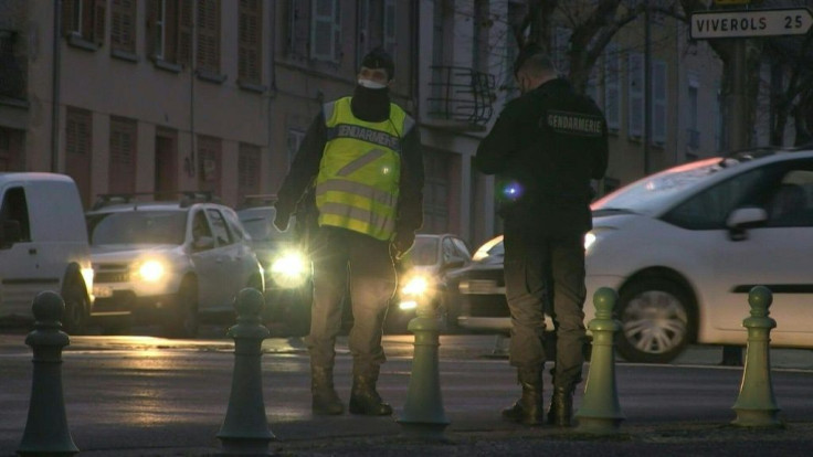 Police officers in the city of Ambert block access to a road leading to Saint-Just, where three police officers were shot dead and another wounded