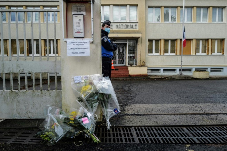 Flowers were placed outside the Gendarmes police station in Ambert, central France, the base for three officers killed