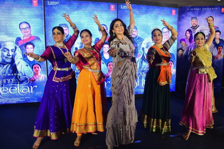 Bollywood actress Shriya Saran (C) and dancers perform for a music video in Mumbai in February. Pandemic restrictions have forbidden producers from shooting the elaborate musical sequences that are a hallmark of Hindi movies