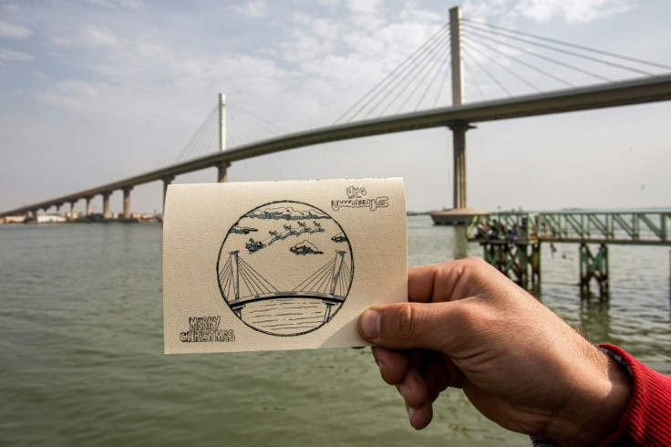 The cards bear images emblematic of the province from which they were sent -- this one from the port city  of Basra shows Santa and his reindeers flying over the city's new bridge across the Shatt al-Arab waterway