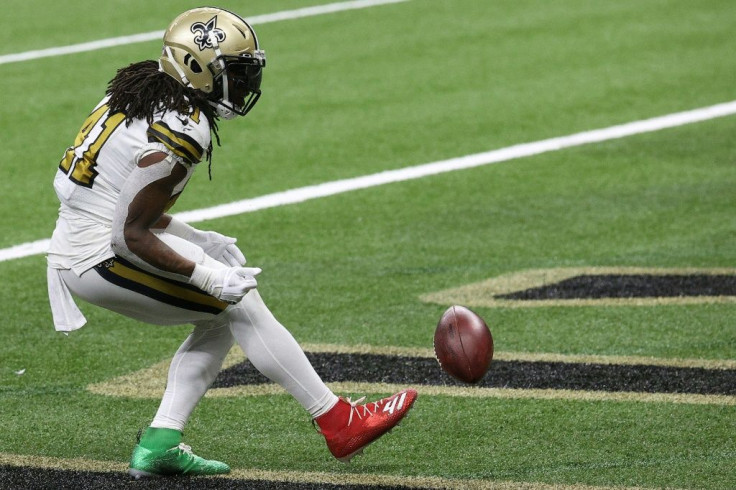 New Orleans Saints running back Alvin Kamara celebrates scoring one of his NFL record-tying six rushing touchdowns Friday in a victory over Minnesota