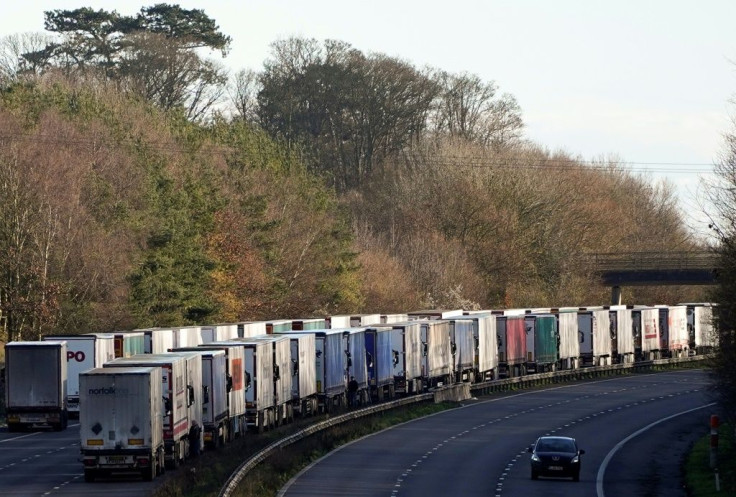 Thousands of trucks were backed up on motorways in southern England on Christmas Day even after France reopened border crossings it had closed due to the new virus strain