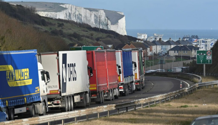 Freight lorries queue on the main route into the port of Dover on the south coast of England on December 10, 2020