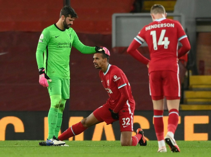 Taking the strain: Liverpool defender Joel Matip (centre) became the latest Premier League player to suffer a muscle injury in Sunday's 1-1 draw with West Brom