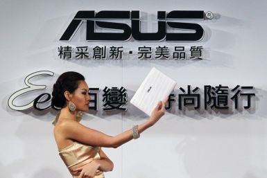A model displays a ASUS netbook during a media launch in Taipei