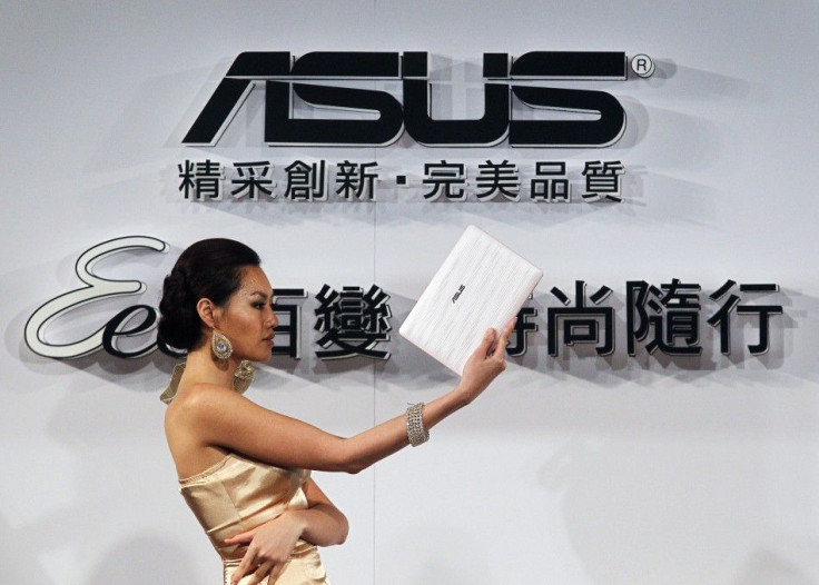 A model displays a ASUS netbook during a media launch in Taipei