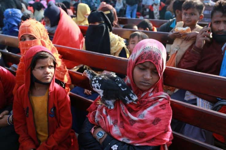 The Rohingya carried bags of belongings, toys and chickens as they sat on wooden benches during the three hour trip from Chittagong to Bhashan Char