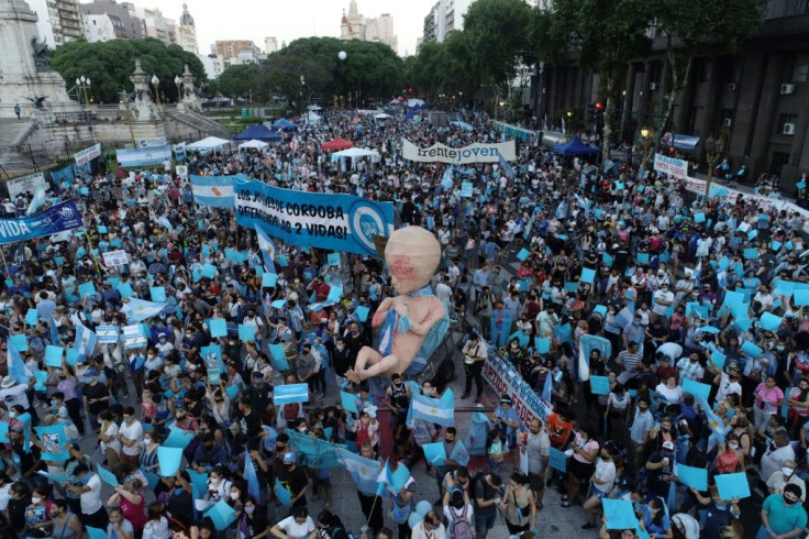 Anti-abortion activists gather outside the Argentine Congress as senators debate a landmark bill on whether to legalize abortion, in Buenos Aires, on December 29, 2020