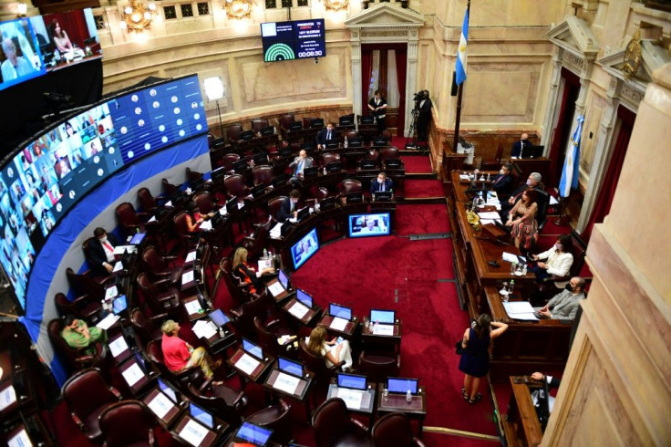 Argentina's Vice-President Cristina Fernandez de Kirchner (R) opens the session at the Senate to decide whether to legalize abortion, in Buenos Aires, on December 29, 2020