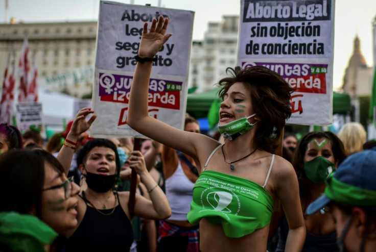 Abortion rights activists demonstrate outside the Argentine Congress as senators debate a landmark bill on whether to legalize abortion, in Buenos Aires, on December 29, 2020