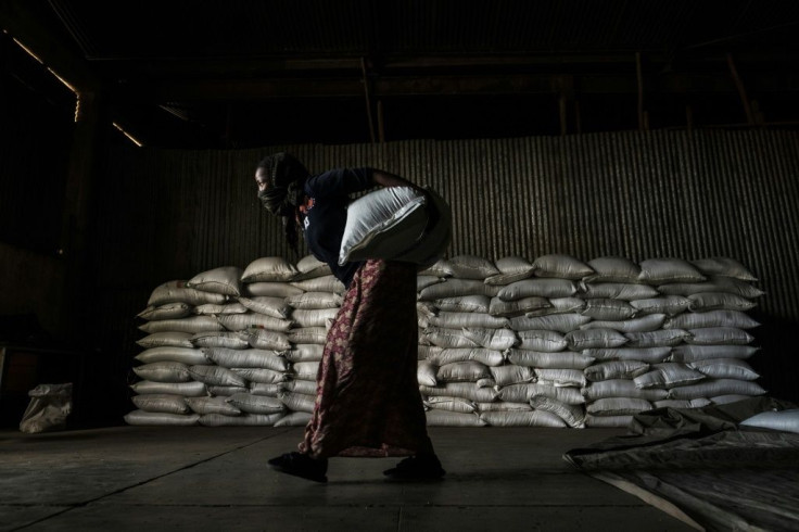 A woman in Alamata carries a sack of wheat during food distribution organised by the Ethiopian government