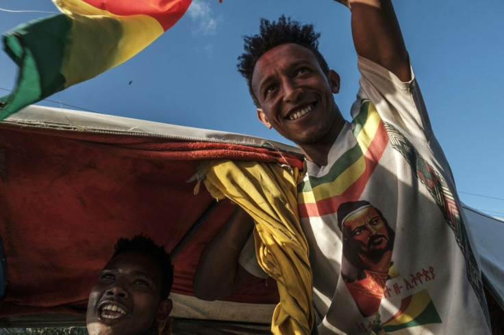 Celebrations: A man waves the Ethiopian imperial flag during an impromptu parade for freed opposition leaders in Alamata