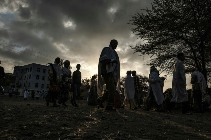 Ethiopian Orthodox worshippers walk towards the Eyesus Church in Alamata