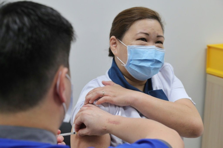 The city-state, which has suffered a mild outbreak, became the first country in Asia to approve the Pfizer-BioNTech vaccine