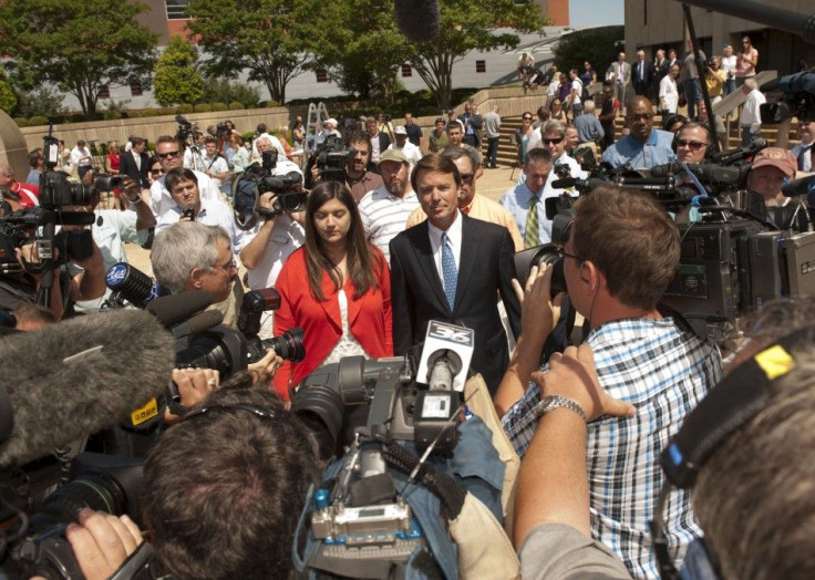 John Edwards and his daughter, Cate Edwards depart from the U.S. District Court in Winston-Salem North Carolina