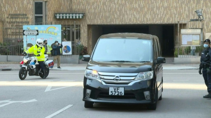 IMAGES Two minors from the so-called "speedboat fugitives" return to Hong Kong after they admitted wrongdoing. The pair arrived back in the city from neighbouring Shenzhen and arrived at a police station around noon in a black van, escorted by police.