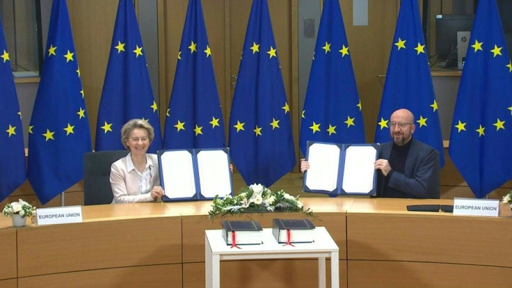 IMAGES EU leaders Ursula von der Leyen and Charles Michel sign the post-Brexit trade deal agreed with Britain, in a brief ceremony.