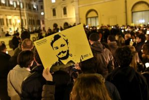 Amnesty International activists  hold a picture of student Giulio Regeni who was murdered in Egypt as they take part in a demonstration in front of the Italian Parliament in Rome in January 2017 a year after his killing