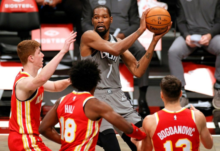 Brooklyn's Kevin Durant looks to pass against Atlanta's Kevin Huerter, Solomon Hill and Bogdan Bogdanovic in the Nets' 145-141 NBA victory over the Hawks