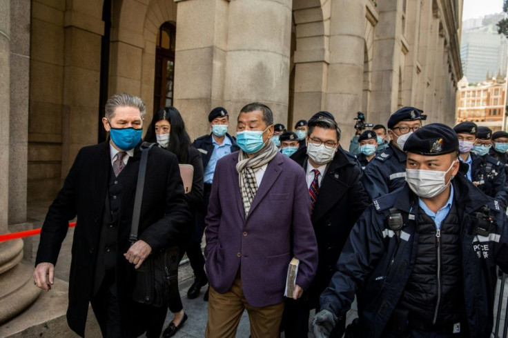 Jimmy Lai (centre) outside the Court of Final Appeal, ahead of its decision to send him back to jail