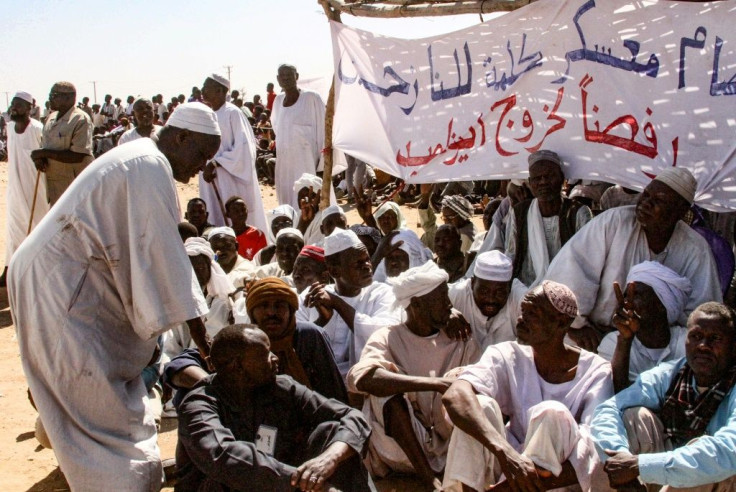 Displaced Darfuris stage a sit in to protest against the withdrawal of the United Nations-African Union peacekeeping mission