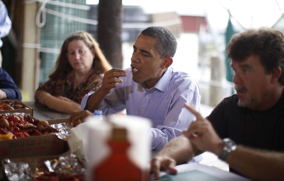 U.S. President Obama eats a shrimp in Grand Isle