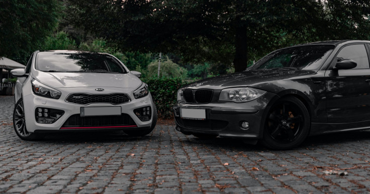 Passenger cars with touring and performance tires mounted.