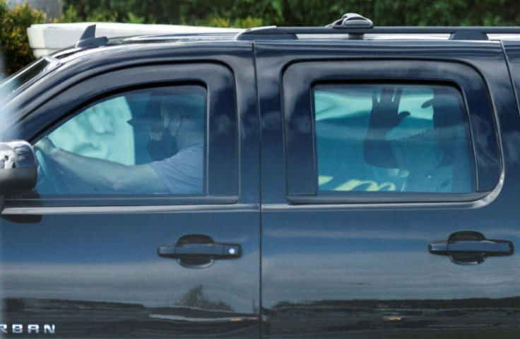 US President Donald Trump waves as he leaves the Trump International Golf Club in West Palm Beach, Florida