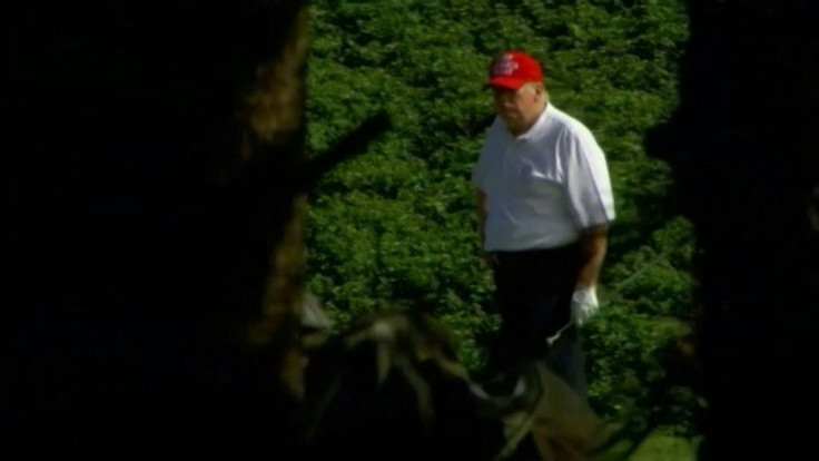 IMAGESUS President Donald Trump plays golf at his club in West Palm Beach,  Florida. Trump's golf outing comes a day after he signed a massive $900 billion stimulus bill that extends benefits to millions of Americans struggling through the pandemic. [COMP