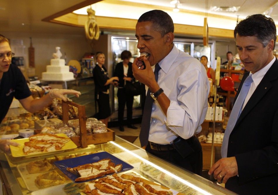 U.S. President Obama stops at bakery before attending a town hall meeting about the economy in Wisconsin