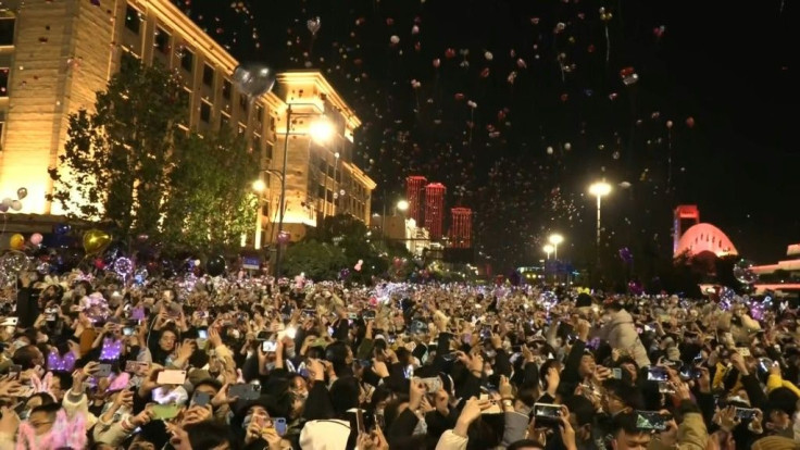 IMAGESPeople celebrate New Year's Eve at the banks of the Yangtze River in Wuhan, the first epicentre of the coronavirus.