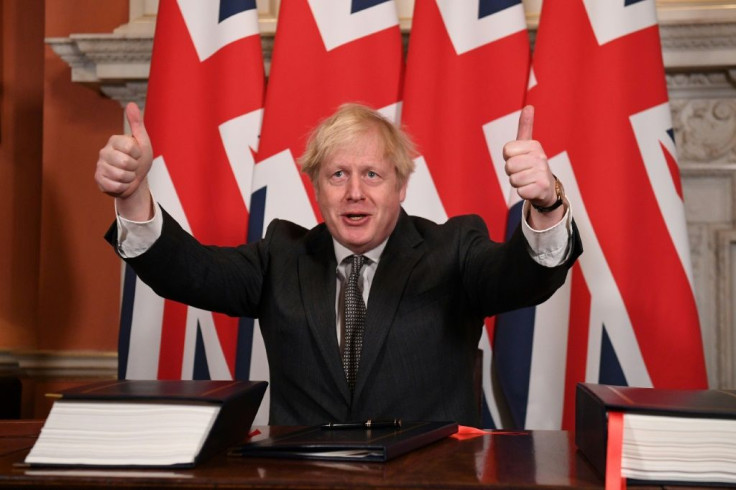 Britain's Prime Minister Boris Johnson gives a double thumbs up after signing the post-Brexit trade deal with the EU