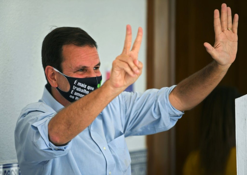 Rio de Janeiro's new mayor, Eduardo Paes, is seen waving after voting in municipal elections on November 29, 2020