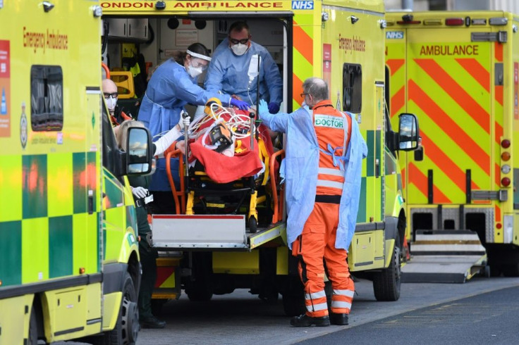 London Ambulance staff stretcher a patient from the ambulance into The Royal London Hospital in east London