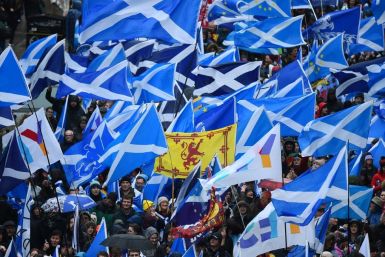 Demonstrators wave Scottish Saltire flags at a pro-indepndence rally in Glasgow in January 2020