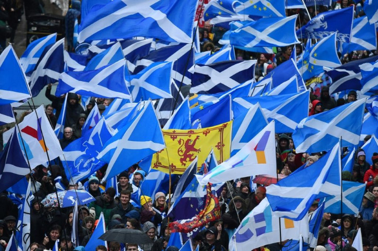 Demonstrators wave Scottish Saltire flags at a pro-indepndence rally in Glasgow in January 2020