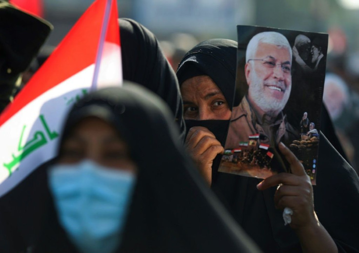Pro-Iranian protestors, many dressed in black, massed in Baghdad where they also condemned Iraq's prime minister as a "coward" and an "agent of the Americans"
