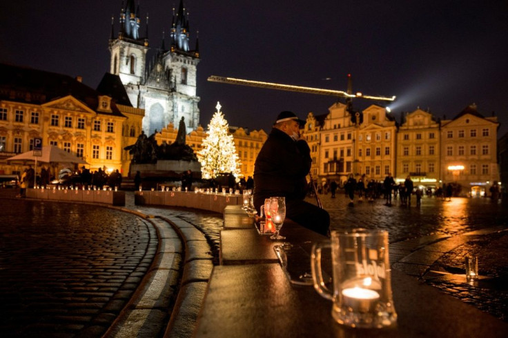Beer glasses with candles were placed in the Old town Square in Prague during the protest over virus restrictions