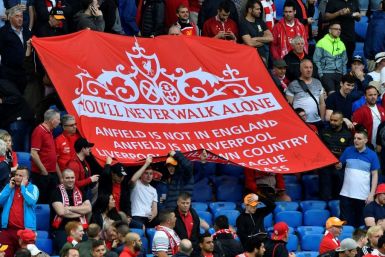 Liverpool's supporters hold a banner reading "You'll Never Walk Alone", a reference to Gerry Marsden's version of the song