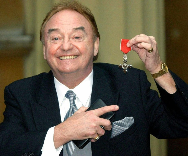 Gerry Marsden receiving his MBE medal at Buckingham Palace in 2003, for services to Liverpool charities