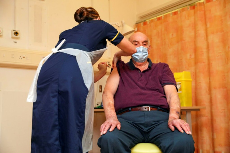 Brian Pinker, 82, says "it's the only way of getting back to a bit of normal life" as he receives the Oxford University/AstraZeneca COVID-19 vaccine from nurse Sam Foster at the Churchill Hospital in Oxford