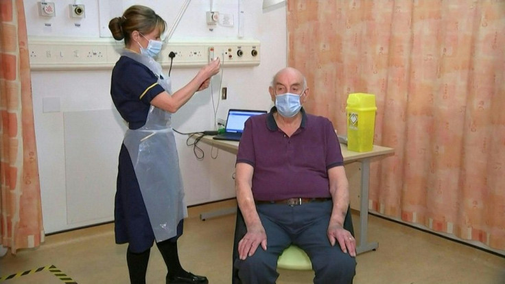 The rollout of the Oxford/AstraZeneca Covid-19 vaccine begins as a patient in Oxford becomes the first to receive it. Dialysis patient Brian Pinker, 82, recieves the vaccination at the Oxford University Hospitals NHS Foundation.