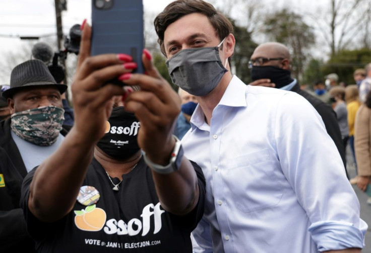A supporter takes a selfie with Democratic Senate candidate Jon Ossoff