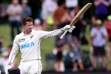 New Zealand's Henry Nicholls celebrates reaching his century against Pakistan