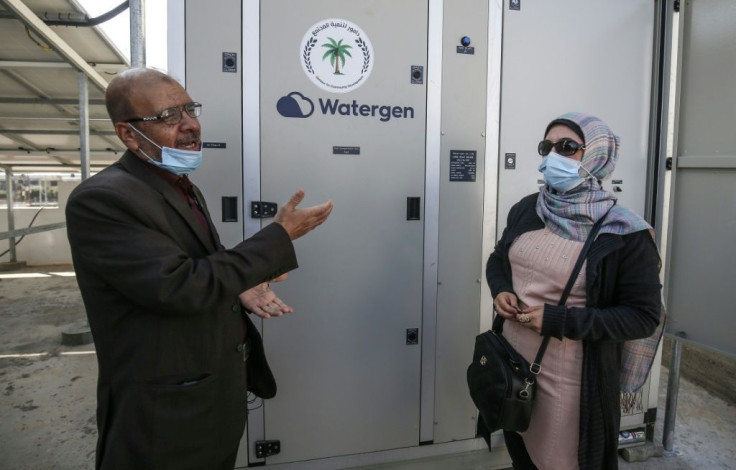 Fathi Sheikh Khalil (L), an engineer with the Palestinian civil society group Damour said the Watergen generators are 'a start' toward tackling a worsening water crisis in the Gaza Strip