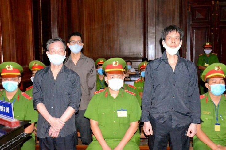 Vietnamese bloggers Pham Chi Dung (R), Nguyen Tuong Thuy (L) and Le Huu Minh Tuan (3rd L) were jailed on anti-state charges on Tuesday